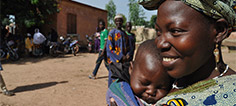 Photo of woman holding her child.