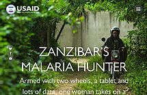 Zanzibar's Malaria Hunter - a woman rides a scooter