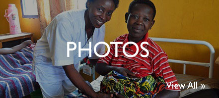 A nurse helps a new mother at a hospital.