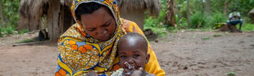 A mother feeds her child