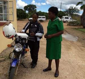 Photo of a moto driver delivering samples