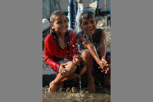 Children Play in Water Tap