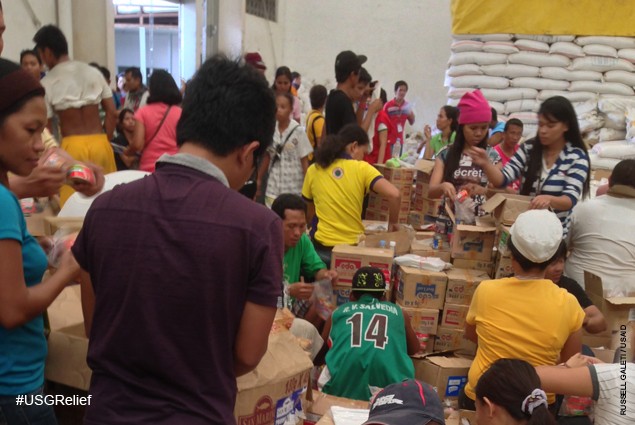 Warehouse at Tacloban Task Force Logistics headquarters where volunteers sort and emergency supplies provided by USAID and other