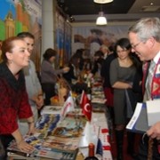 US Ambassador to Armenia John Heffern stops by the visitor booth of Turkish partners at the event.